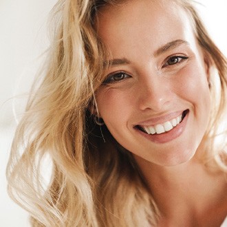 Closeup of woman with blonde hair smiling